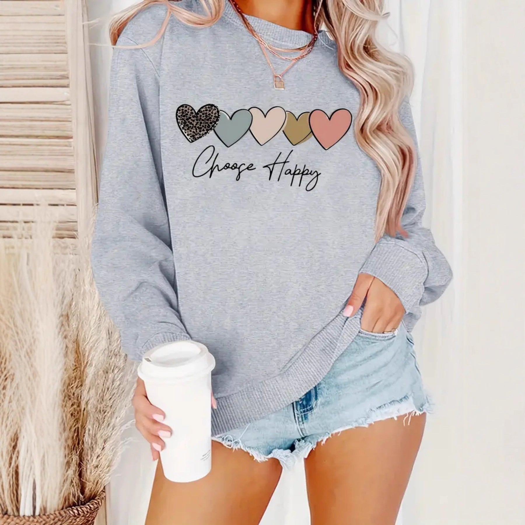Sweatshirt with heart-shaped pattern print