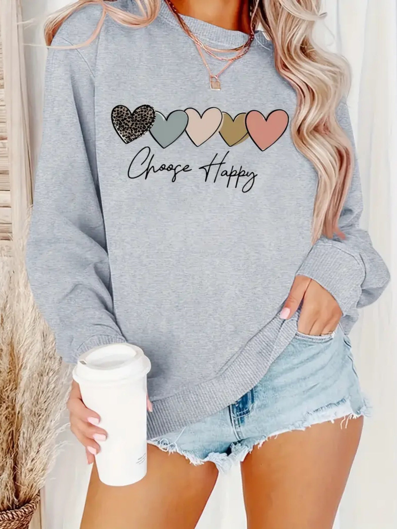 Sweatshirt with heart-shaped pattern print